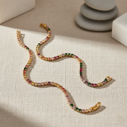 Multicolored tennis bracelets on a textured surface