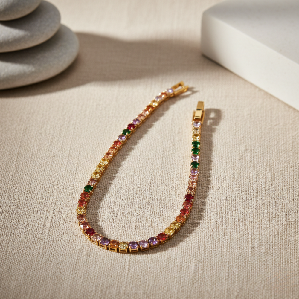 Multicolored yellow tennis bracelet on a beige surface