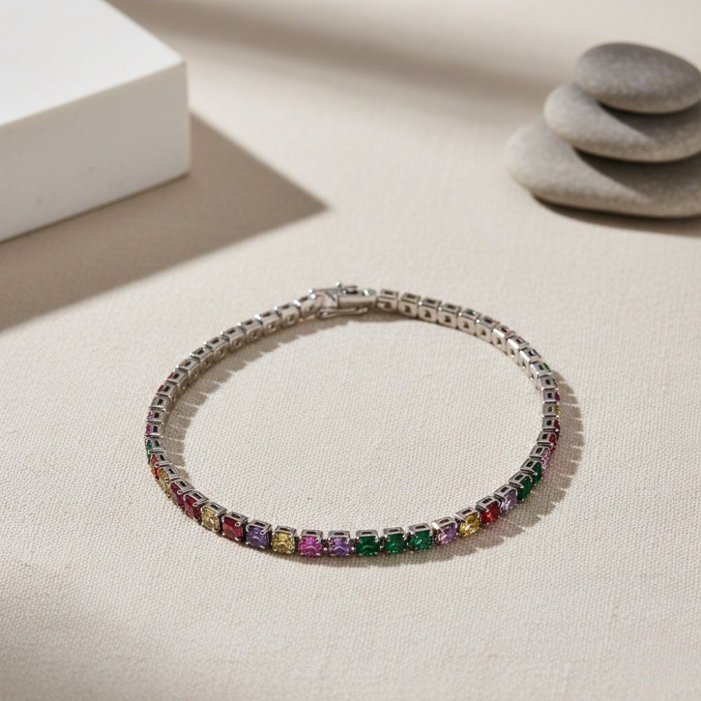 Multicolored gemstone white tennis bracelet on a neutral background