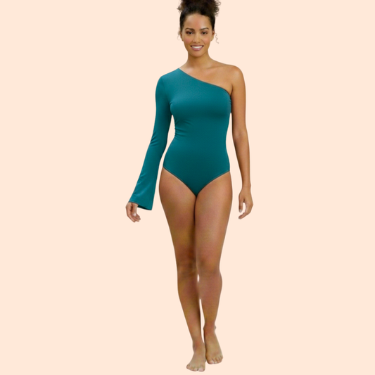 Woman wearing a teal one-shoulder EB bodysuit on a beige background