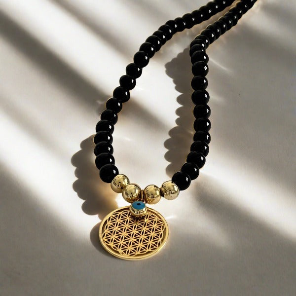 Black beads and eye design necklace