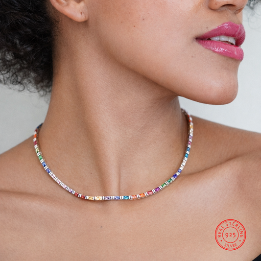 Close-up of a woman wearing a colorful beaded necklace with a visible 925 stamp.