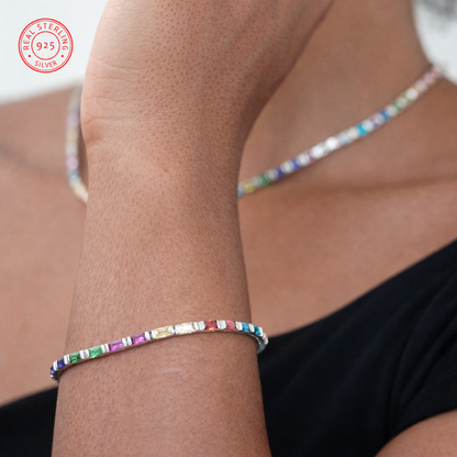 Multicolored beaded bracelet on a wrist with a visible 925 stamp.