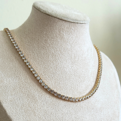 Zirconia tennis necklace on a mannequin bust with a neutral background